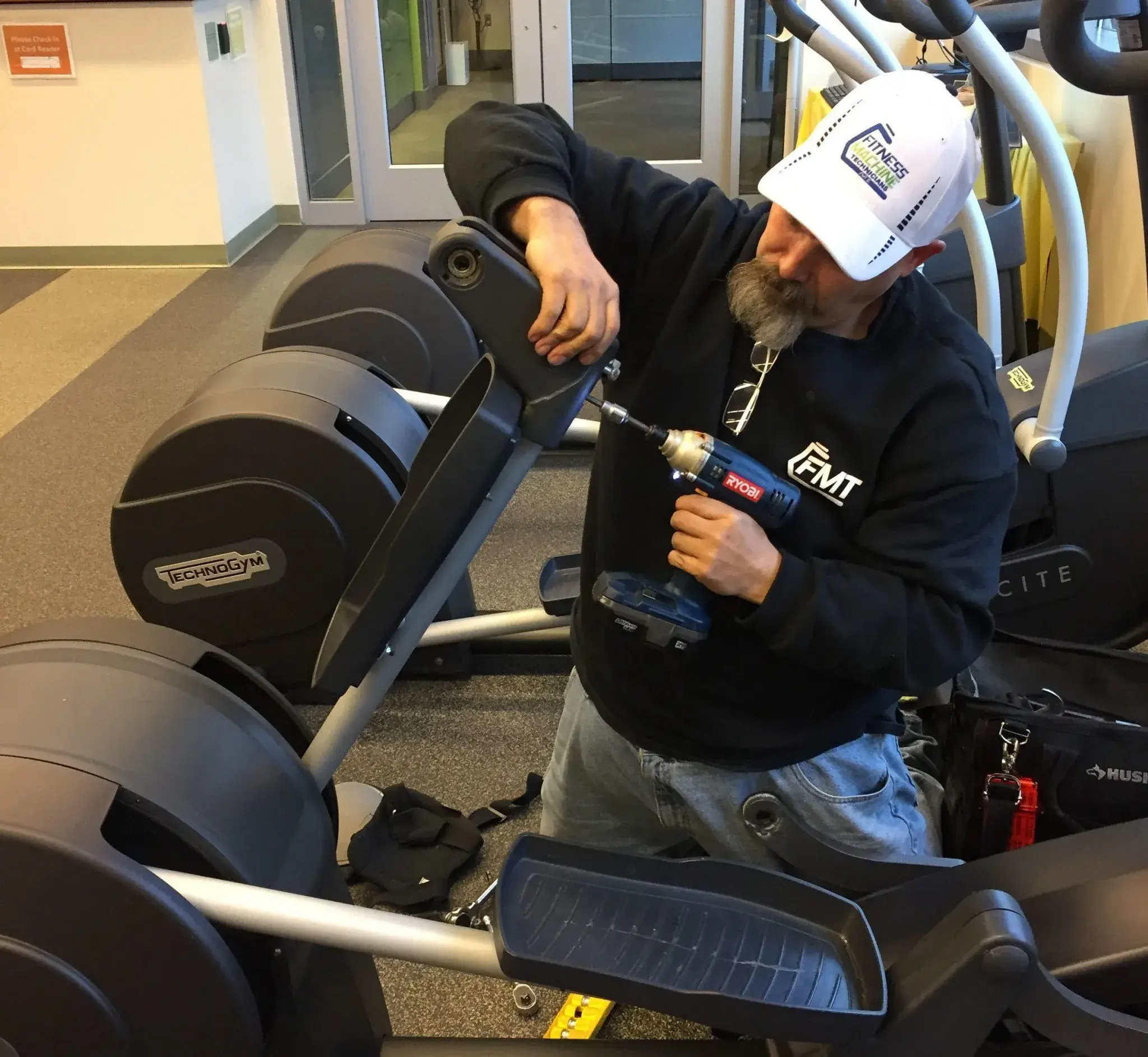 Bryan removing broken parts of the machine