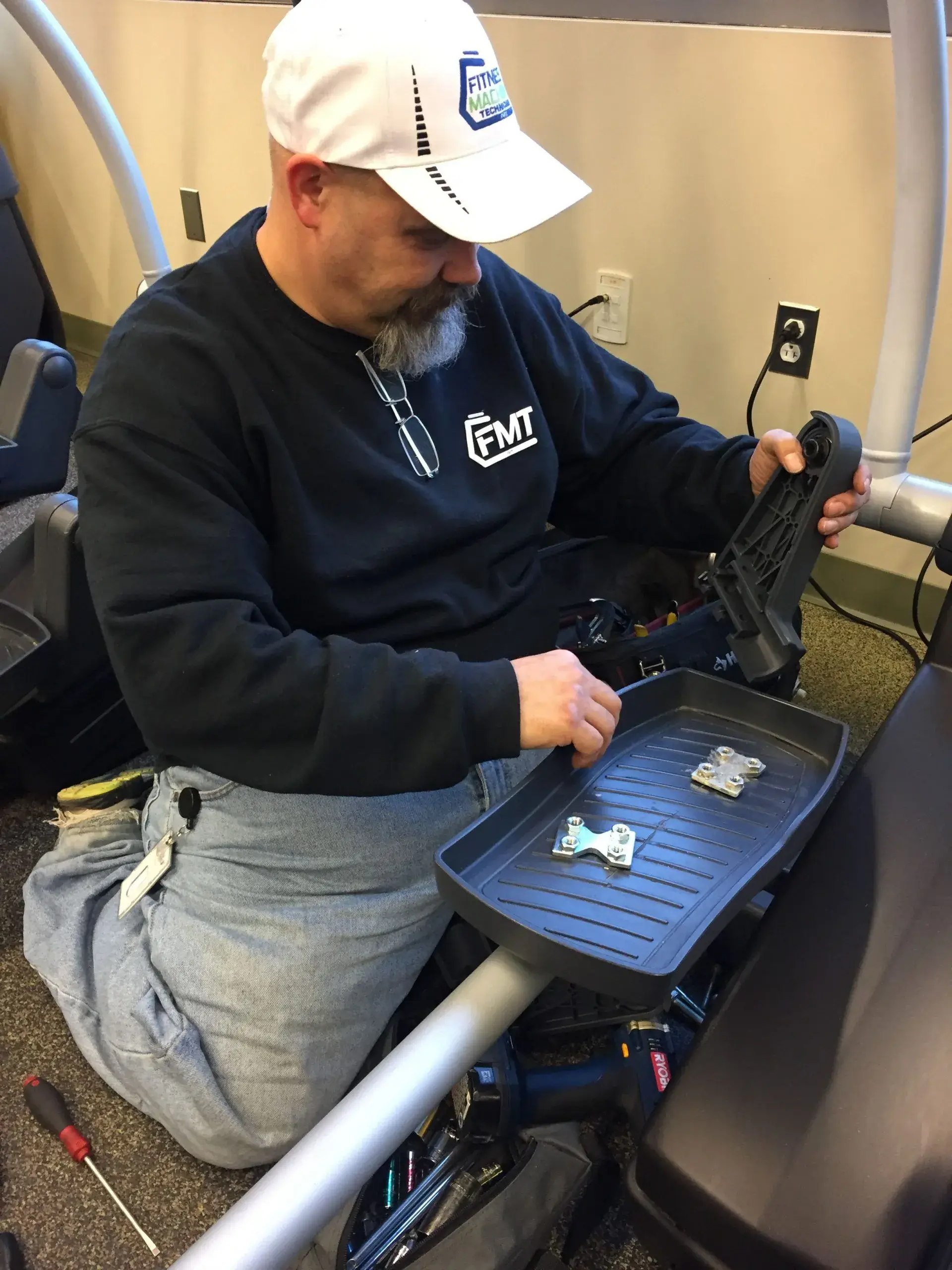 Bryan removing broken parts of the machine