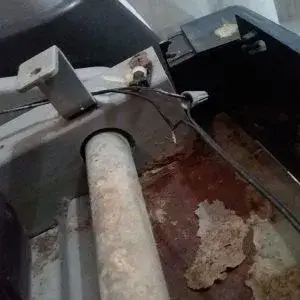 A close-up view of a rusted and corroded metal component